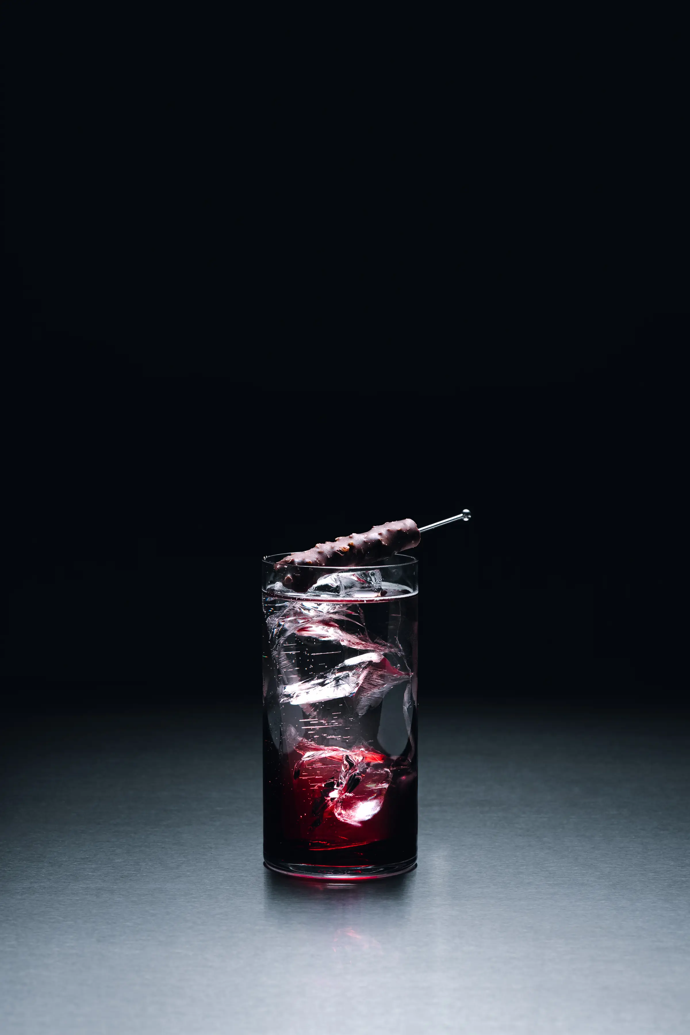 A long drink over cracked ice at the bar of Holographik Space