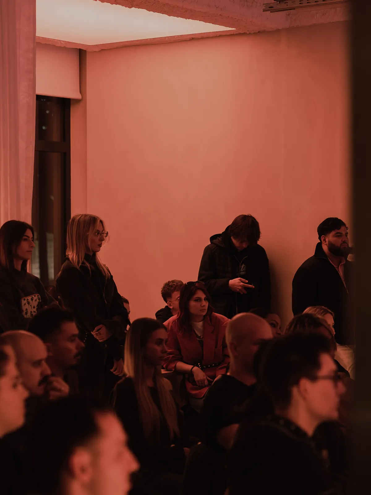 Guests standing at the back of the floor